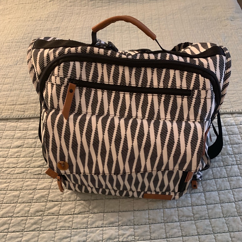 Diaper bag in the style of jujube bff.